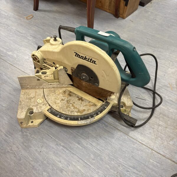 Makita LS1040 mitre saw for spares or repair, showing the teal body.