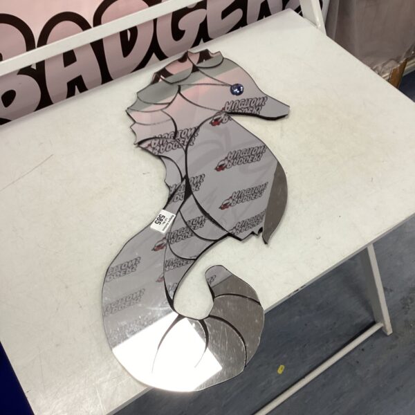Vintage seahorse shaped mirror for quirky home decor.