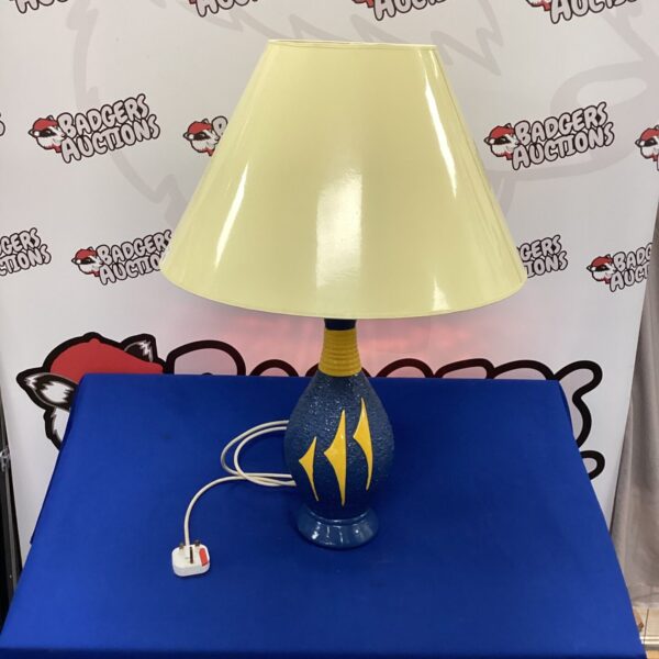 Vintage Art Deco table lamp with geometric base and shade.