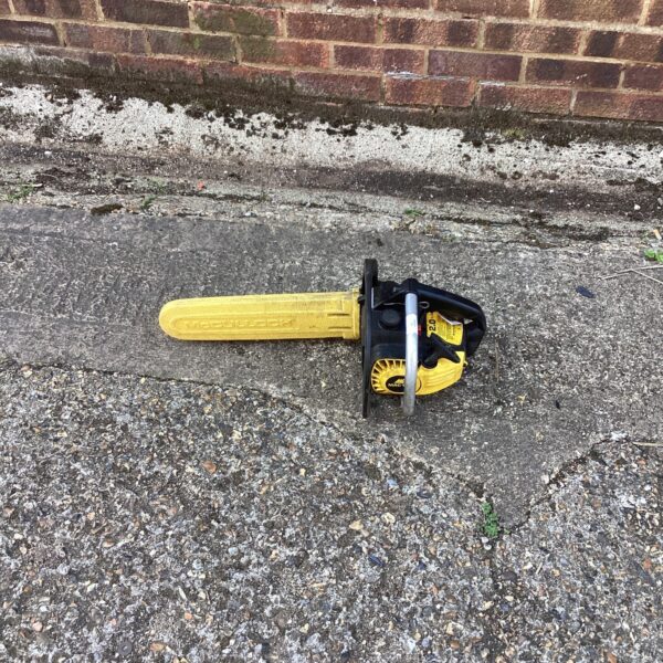 Vintage McCulloch Mac 130 petrol chainsaw for garden use.