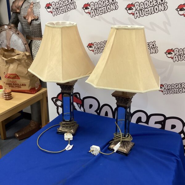Vintage mirrored column lamps, a glamorous pair for home decor.
