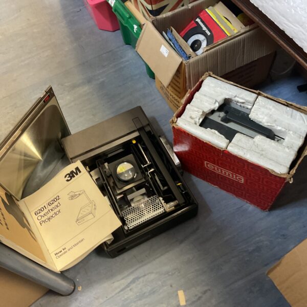 Vintage 3M overhead and Eumig 8mm film projectors in a lot.