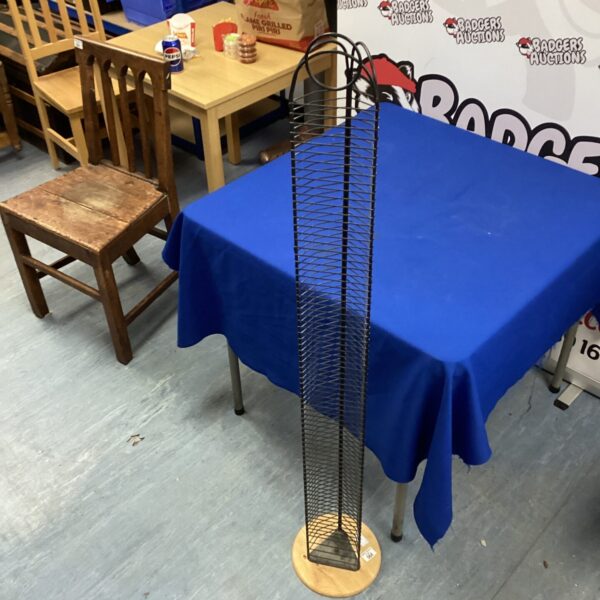 Black metal CD storage rack for media organisation.