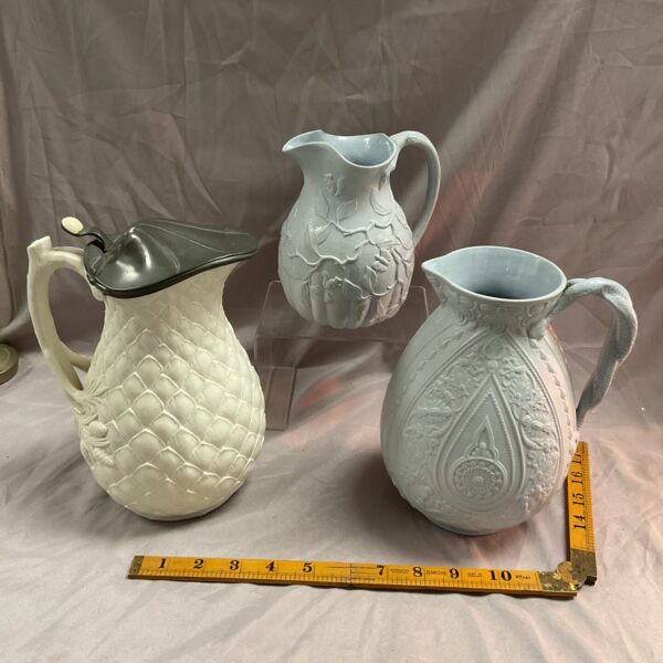 Antique Victorian Parian ware jug with detailed floral relief decoration.