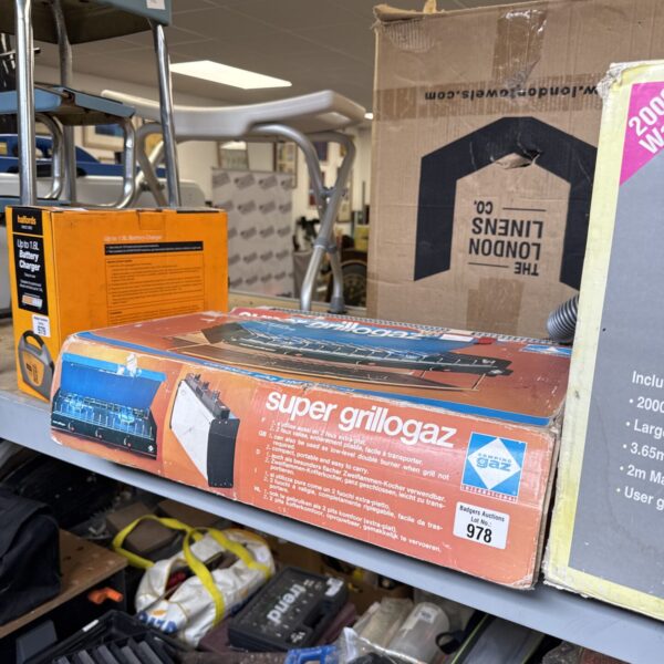 Vintage camping gas cooker in original packaging.