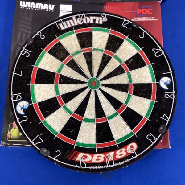 Front view of a used Unicorn bristle dartboard.