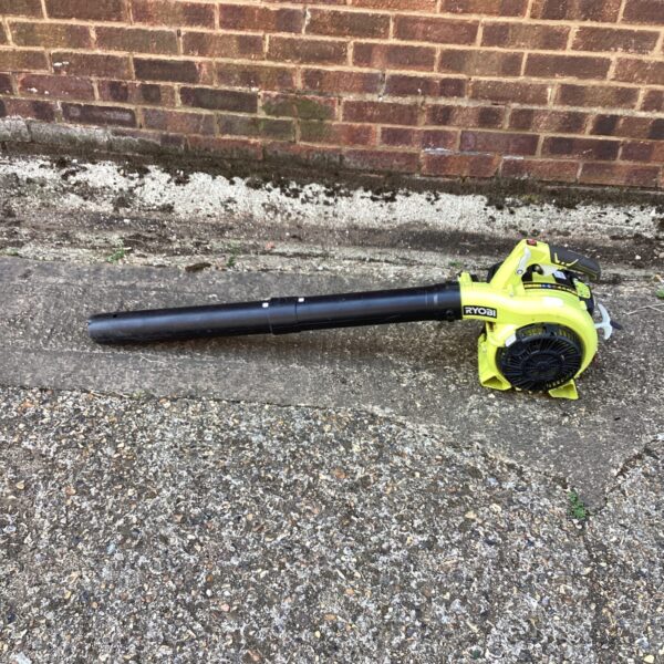 Ryobi petrol leaf blower for garden clearing and maintenance.
