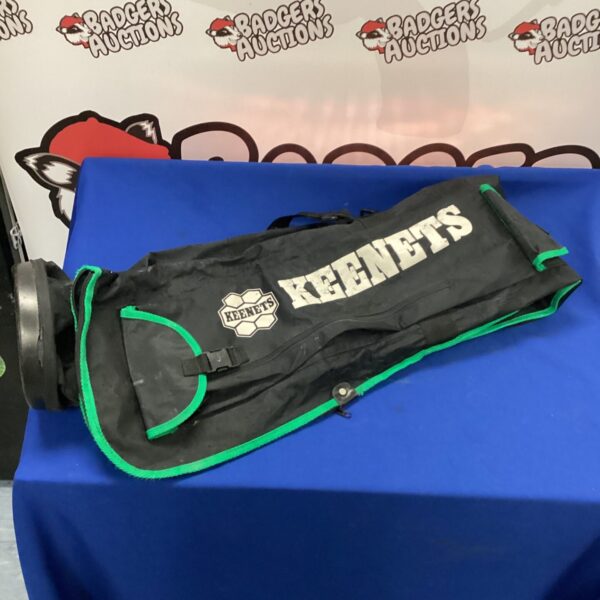 Front view of a used Keenets fishing bag with multiple compartments.