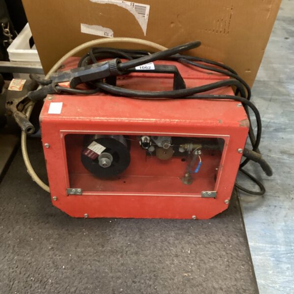 Front view of a vintage Mig Welder, model 1062.