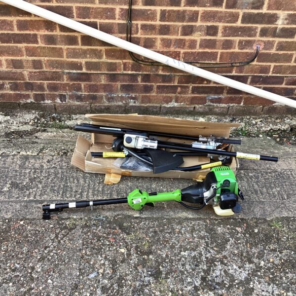 Petrol garden multi tool with various attachments displayed.