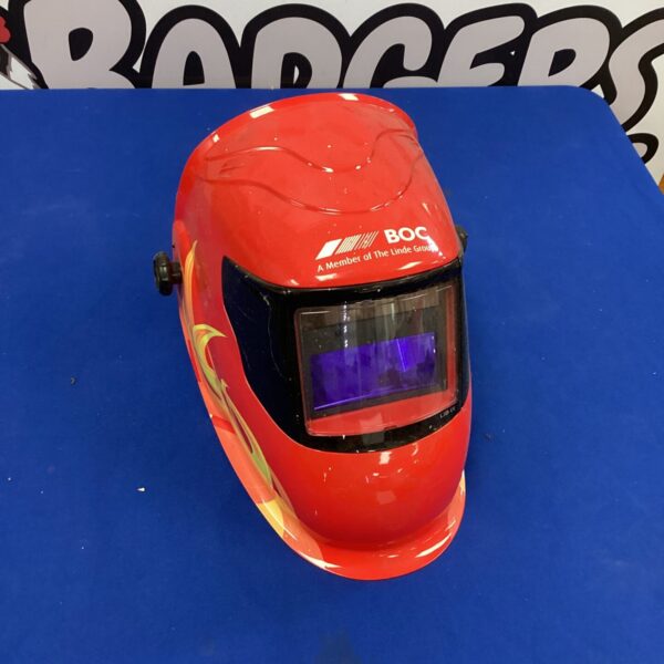 Front view of a used BOC welders mask with a dark visor.