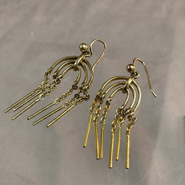 Close-up of 9ct gold menorah earrings with delicate branch details.