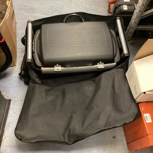 Portable gas barbecue grill, front view, for outdoor cooking.