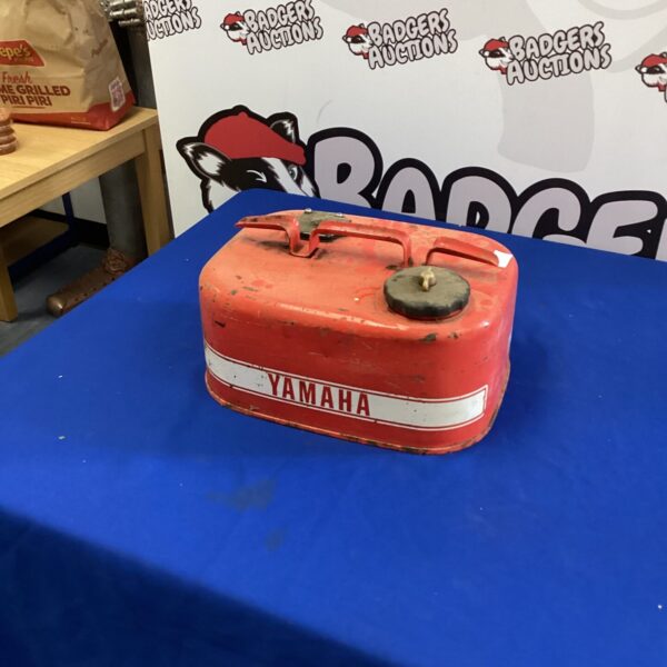 Vintage red Yamaha boat fuel tank, classic marine collectible.