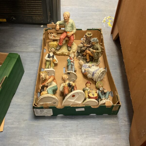 Vintage Capo di Monte and Bondware porcelain figures in a collection.