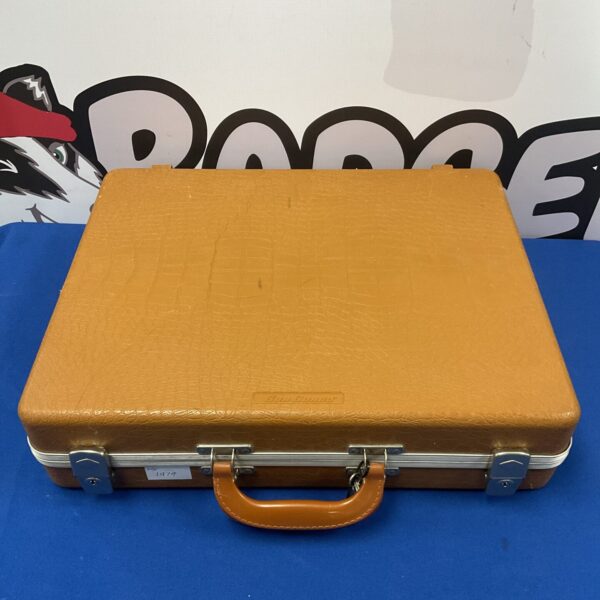 Front view of a vintage lockable gun case.