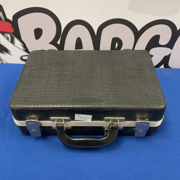 Vintage Doskocil gun case with keys, secure firearm storage.