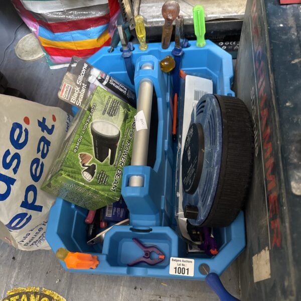 Blue plastic tool trug filled with various garden and workshop tools.