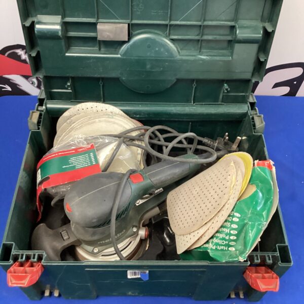 Used Metabo rotary sander with included sanding pads.