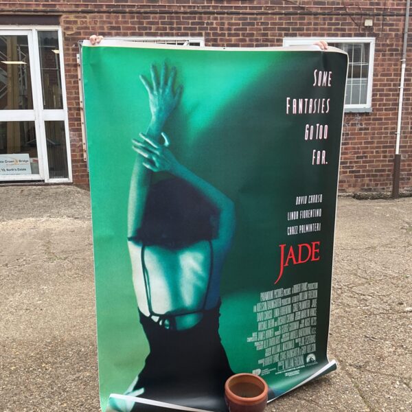 Vintage Paramount Jade cinema lobby posters, vibrant film advertising.