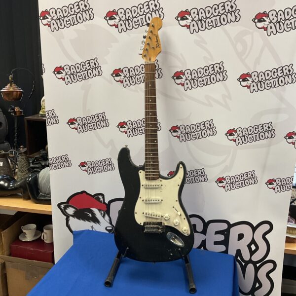 Black Richwood electric guitar with single-coil pickups.