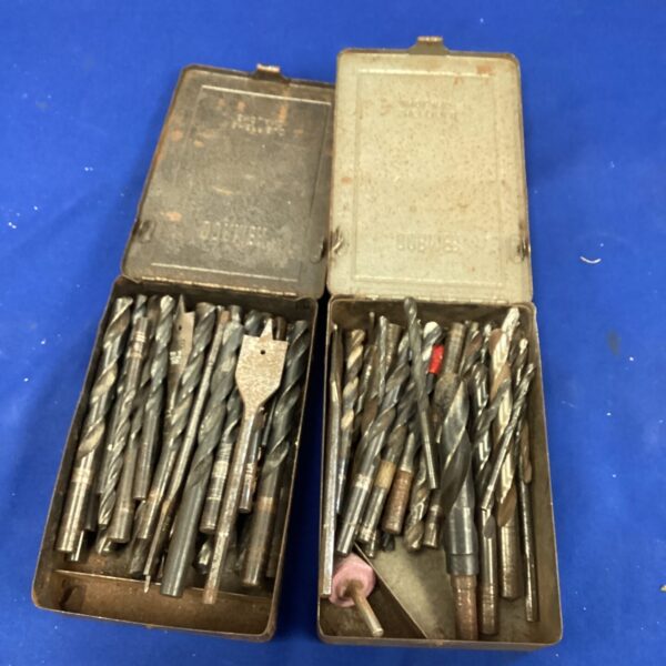 Vintage drill bit sets in metal boxes, antique tools.