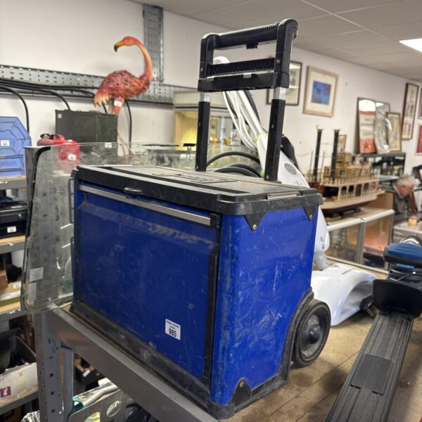 Blue wheeled tool seat with storage compartment for workshop tools.