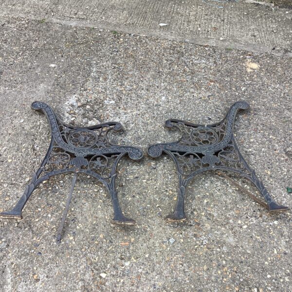 Antique wrought iron bench ends, Victorian style garden seating.
