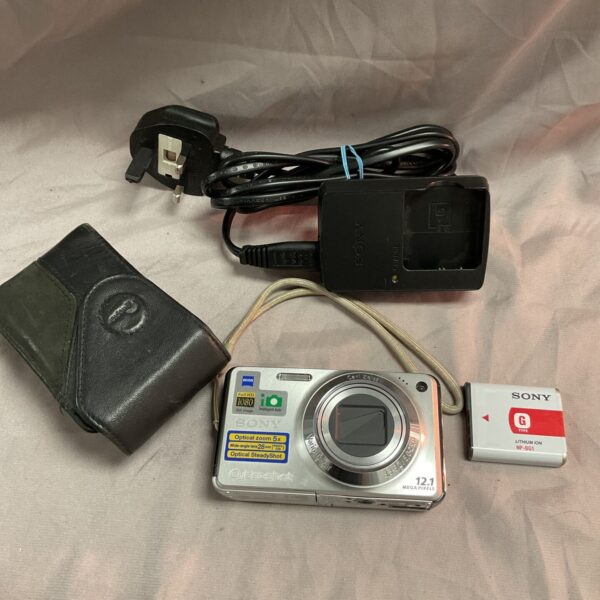 Sony Cyber-shot digital camera with protective case and charger.