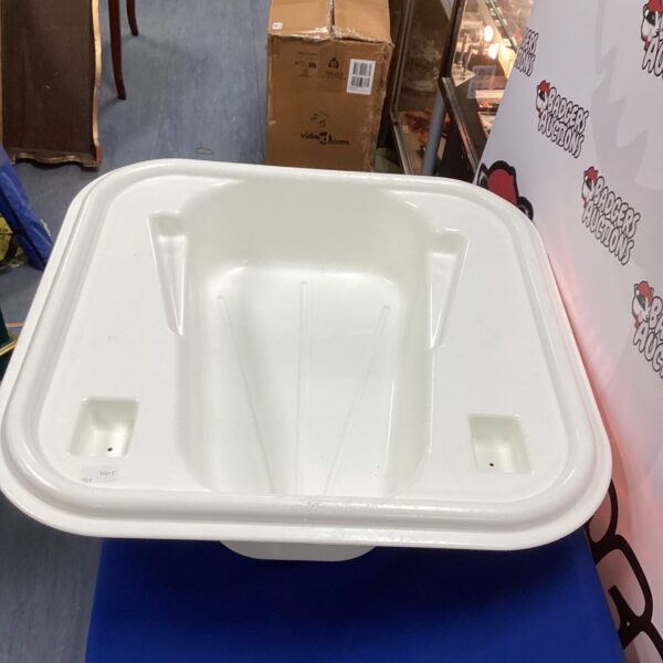 White plastic baby bath insert for safe infant bathing.