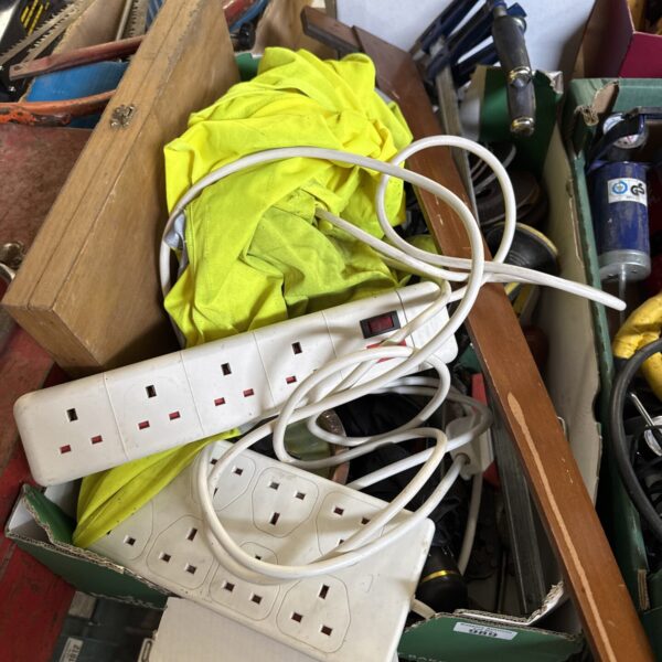 White extension lead with multiple sockets from a house clearance lot.