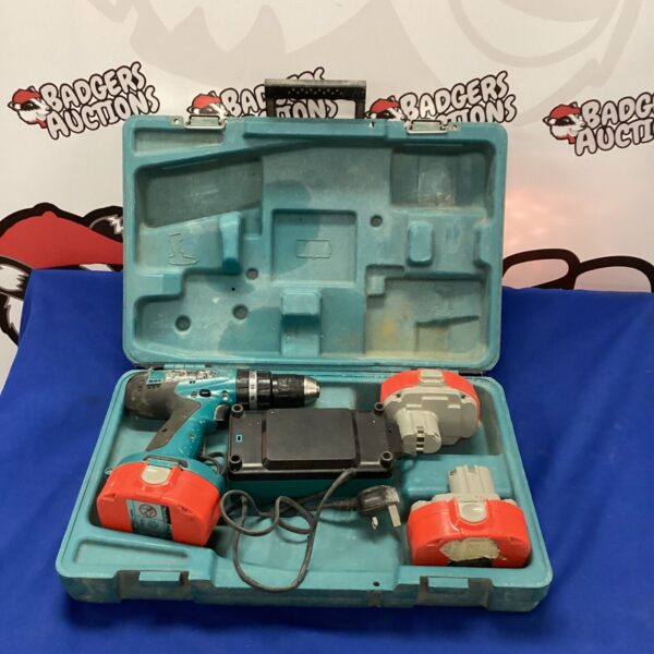 Makita battery drill in original carrying case, cordless power tool.