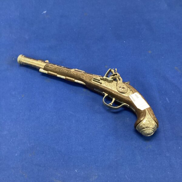 Detailed flintlock toy gun replica for collectors and display.