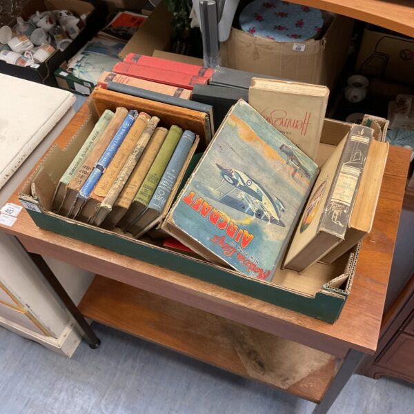 Stack of vintage books, antique book collection.