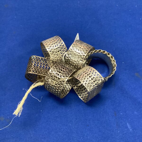 Set of six vintage silver plate napkin rings with pierced design.
