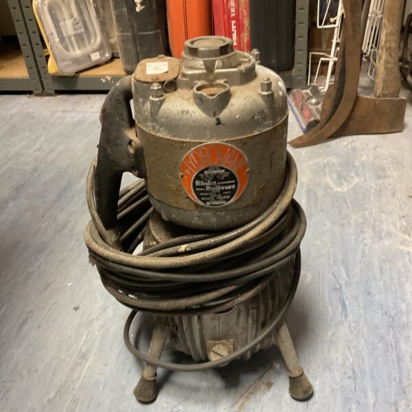 Vintage Binks Hydrovane compressor in a workshop setting.