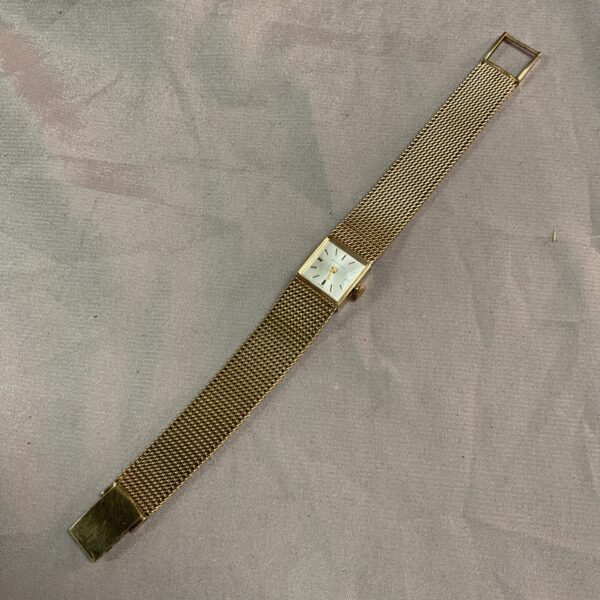 Close-up of Walker Astron 9ct gold woven mesh bracelet.