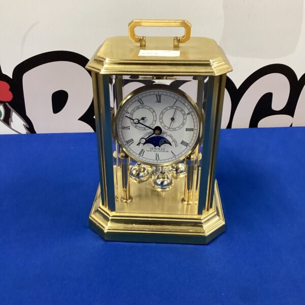 Antique Sewills carriage clock with brass case and enamel dial.