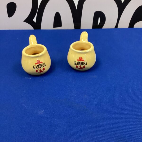 Vintage Kambusa mini ceramic pots for display.