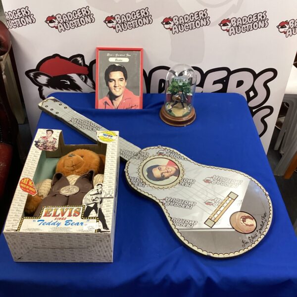 Elvis Presley memorabilia lot featuring teddy bear, mirror and ornament.