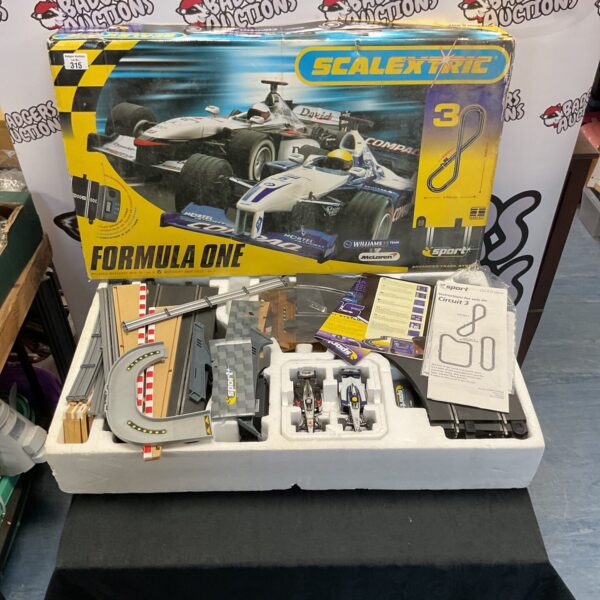 Scalextric Formula One track set in its original box, vintage toy racing.