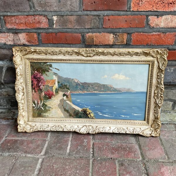 Antique coastal oil painting signed Corbet, depicting a vibrant seascape.