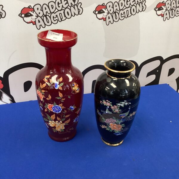 Red porcelain vase with floral and bird decoration.