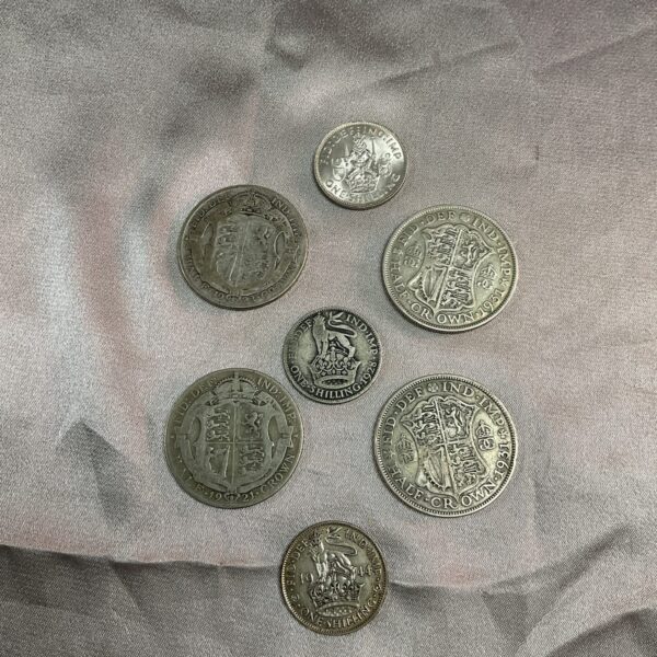 Lot of silver Half Crown coins, including a 1942 shilling.