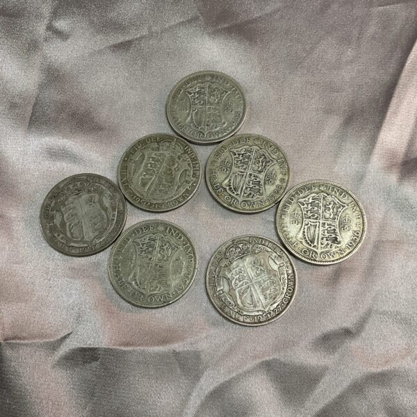 Lot of seven silver half crown coins for collectors.