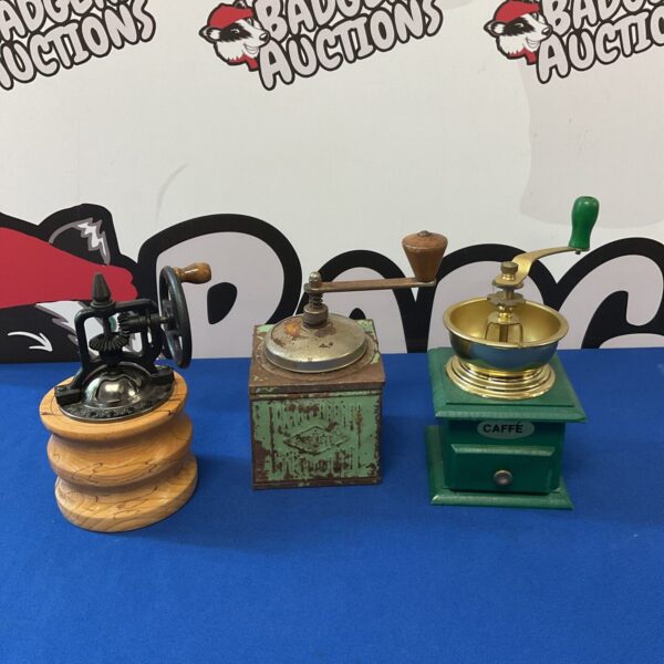 Vintage tin coffee grinder with a decorative painted finish.