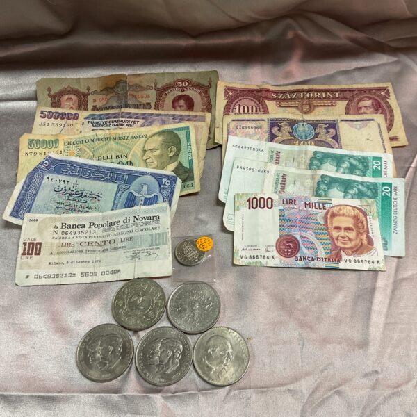 Collection of commemorative banknotes and coins, including Turkish Lira.