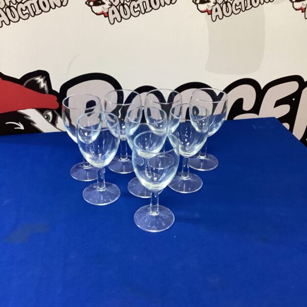 Set of eight clear wine glasses for wine tasting.