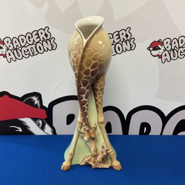 Detailed Franz Porcelain giraffe vase, a beautiful animal figurine.