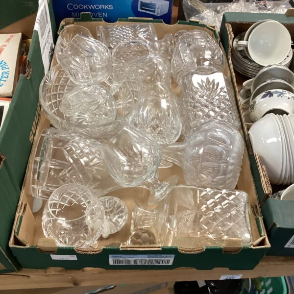 Collection of vintage cut glass decanters and bowls.
